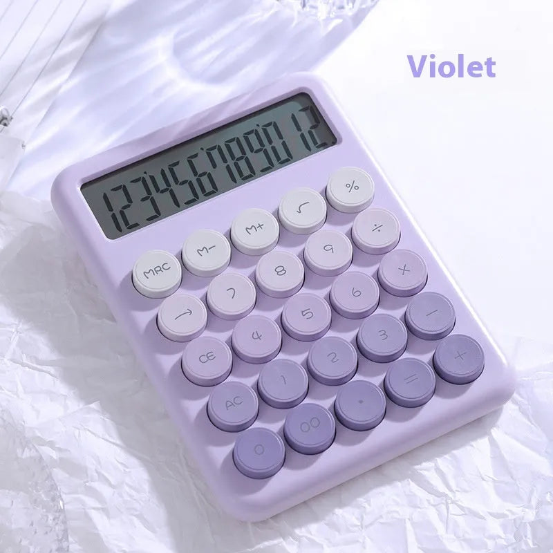 Dopamine gradient colour desk calculator in violet, pink, blue, and mint green on a desk.