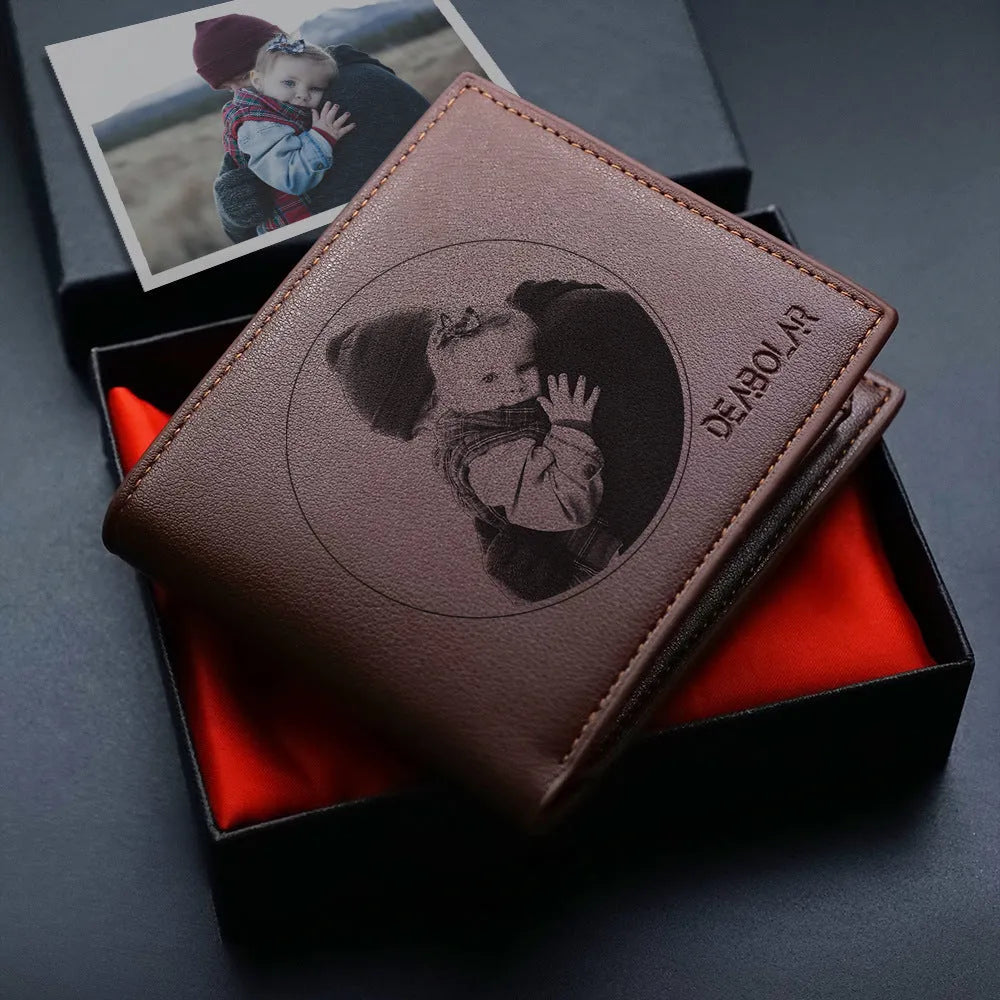 Men's brown leather wallet with a silver zipper closure laid flat.
