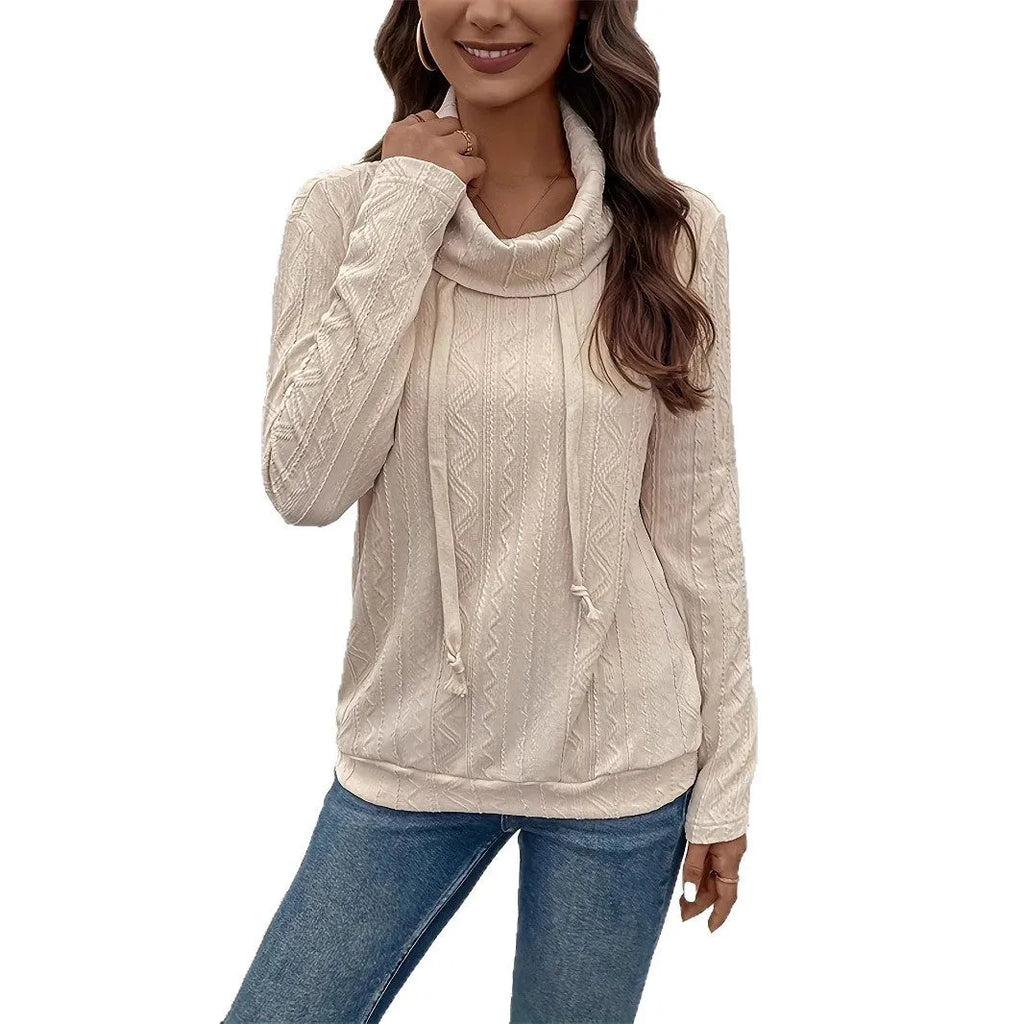 Apricot coloured hooded pullover sweater with drawstring and long sleeves laid flat