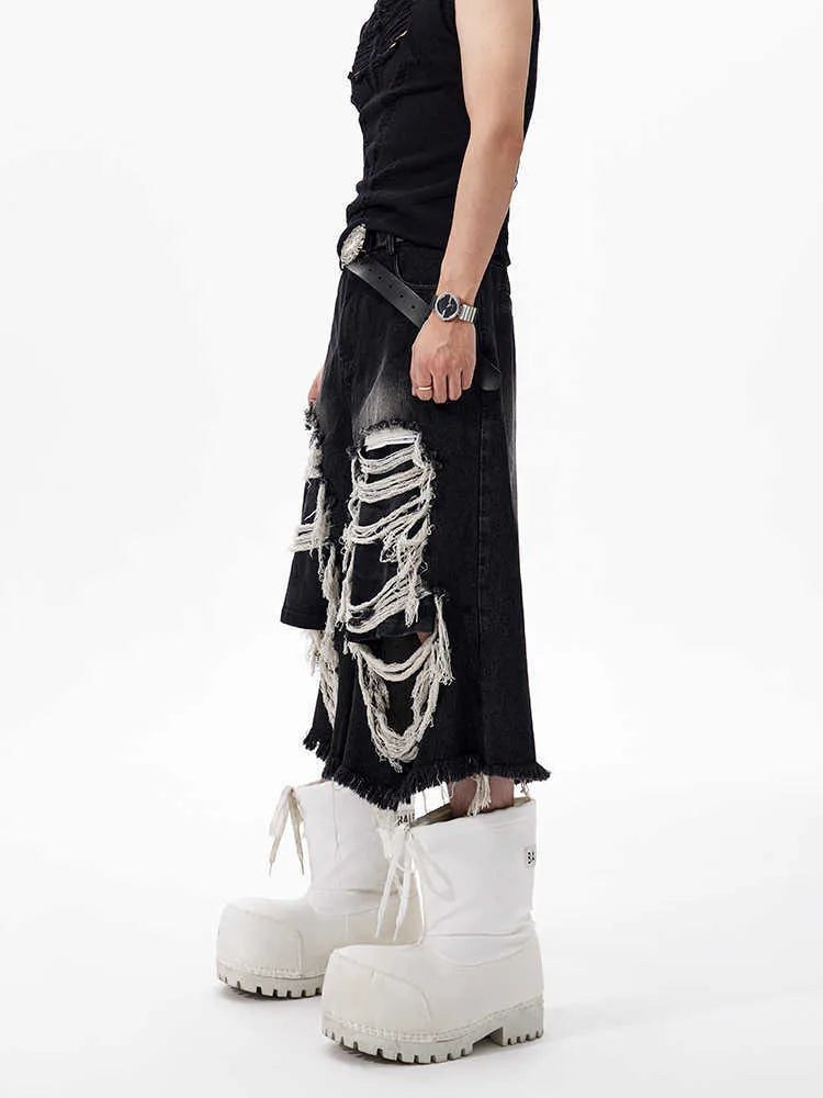 Black women's cropped wide-leg jeans with a mid-high waist and ripped patch distressing.