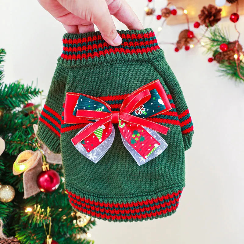Green Christmas pet sweater for a small dog on a festive background.