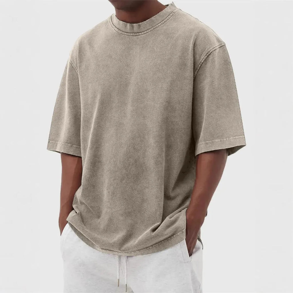 Men's loose fit distressed pullover t-shirt in stone washed polyester showing half sleeve design