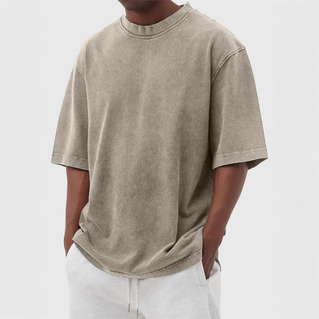 Men's loose fit distressed pullover t-shirt in stone washed polyester showing half sleeve design