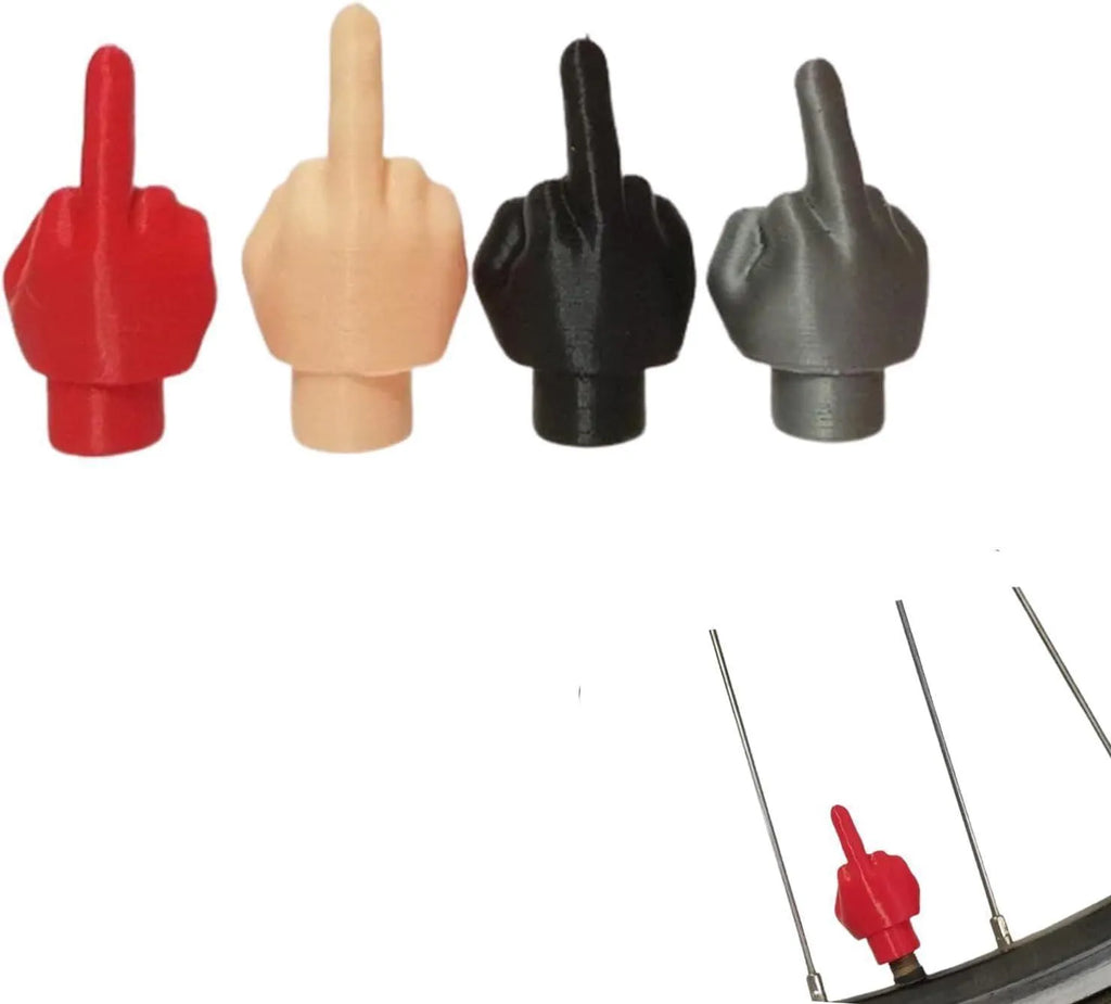 Four black and four skin tone latex tyre valve caps arranged together