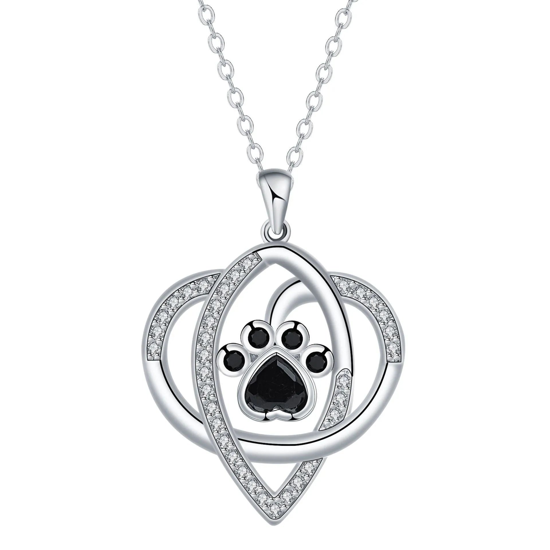 Close-up of a copper necklace pendant showing detailed cat and dog paw prints on a cross chain.