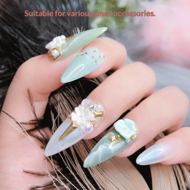 Nail art no-wash gem glue bottle with three iron tube dotting pens on black background
