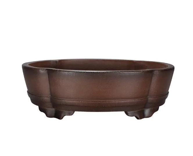 A large, classical-style purple clay flower pot on a wooden floor.