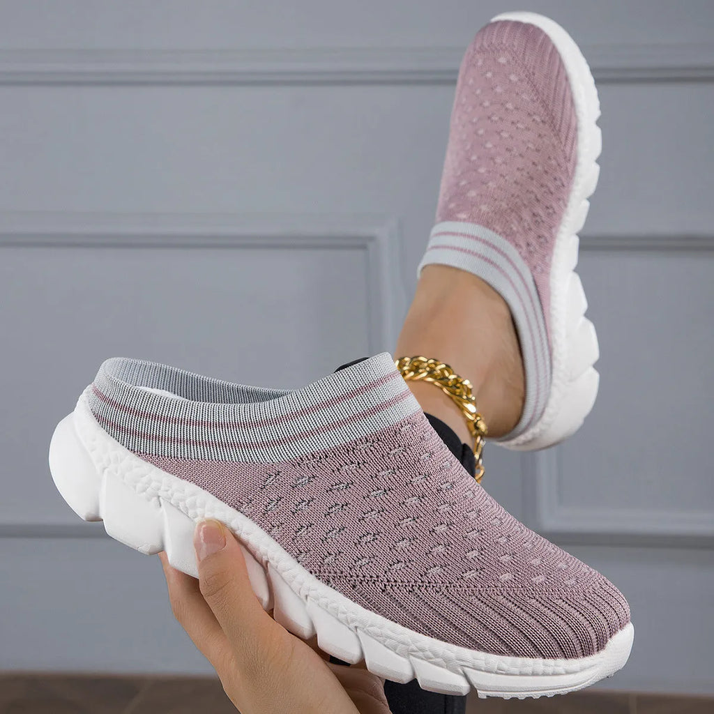Women's black Flyknit slipper shoes with striped pattern and hollowed-out design on a lightweight viscose sole.