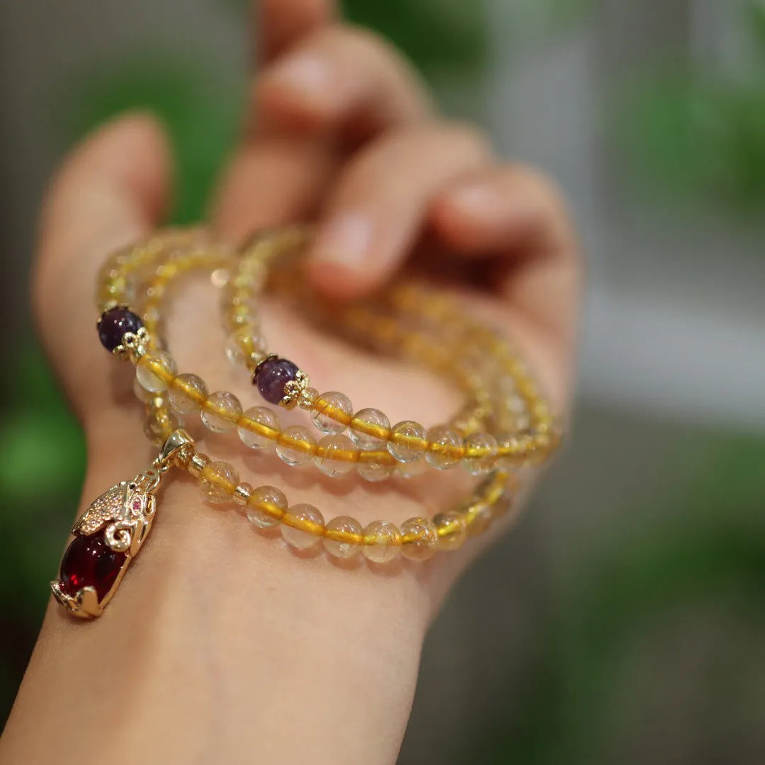 Natural Brazilian gold rutilated quartz bracelet with Chinese three-ring design and chopstick hanging elements