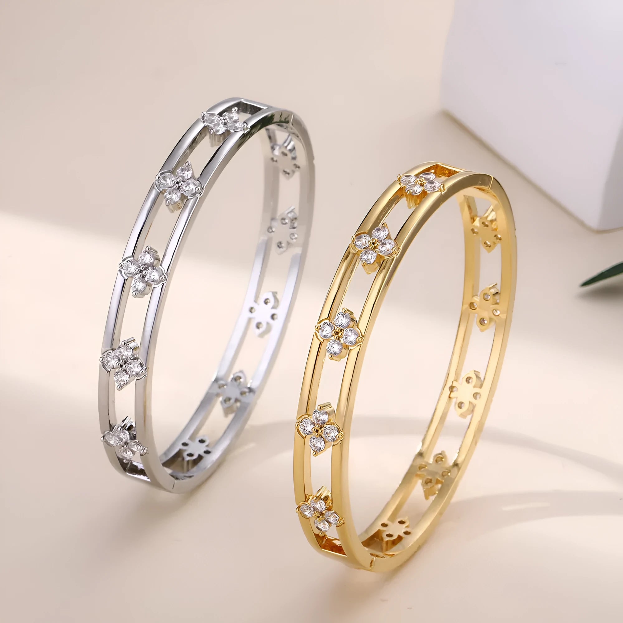 Gold or silver women's hollow bracelet with four-leaf clover design and zircon stones.