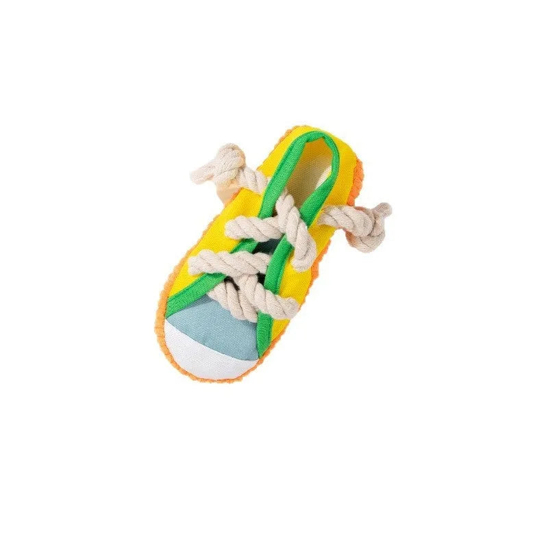 Plastic slipper-shaped dog chew toy in yellow colour for teething relief