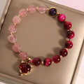Women's simple bracelet with strawberry crystal beads on elastic rope, showing picture-accurate colour