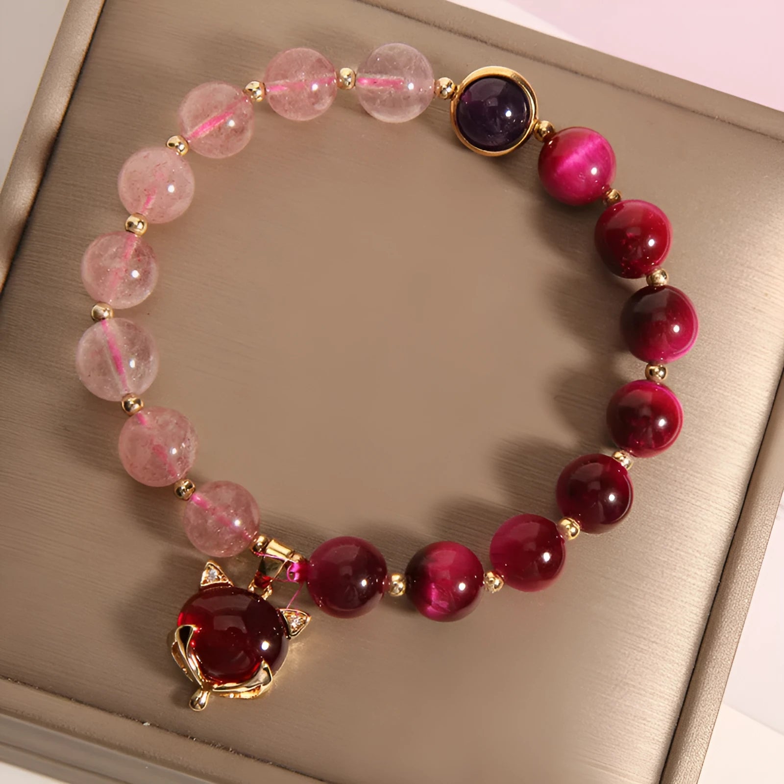 Women's simple bracelet with strawberry crystal beads on elastic rope, showing picture-accurate colour