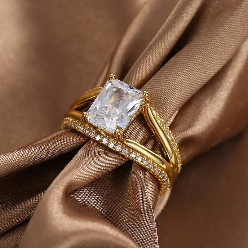 Geometric gold electroplated ring with square zircon stone showing European styling
