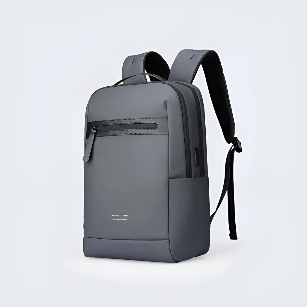 Graphite grey Oxford cloth business backpack with an external USB charging port on the strap.