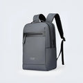 Graphite grey Oxford cloth business backpack with an external USB charging port on the strap.