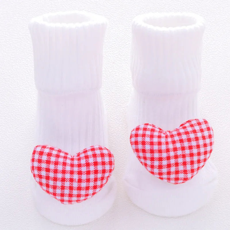 Cotton baby floor socks in various patterns including animal prints, stars, and bows for infants aged 0-3 months