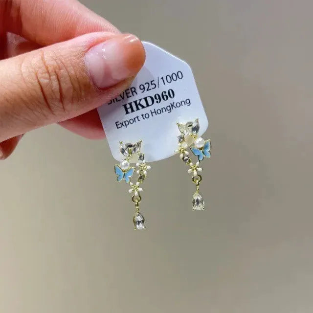 Geometric alloy earrings with rhinestone accents and little star tassel design for women