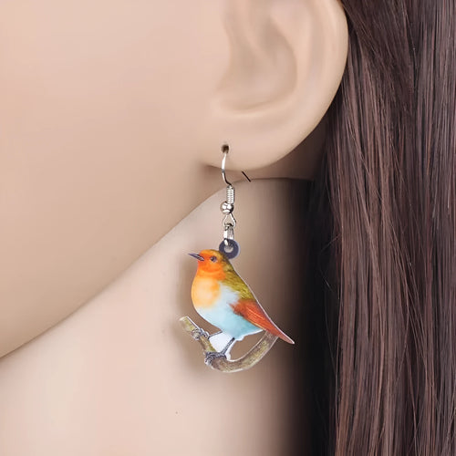 Acrylic blue titmouse pendant earrings with snake charm detail and printed animal design