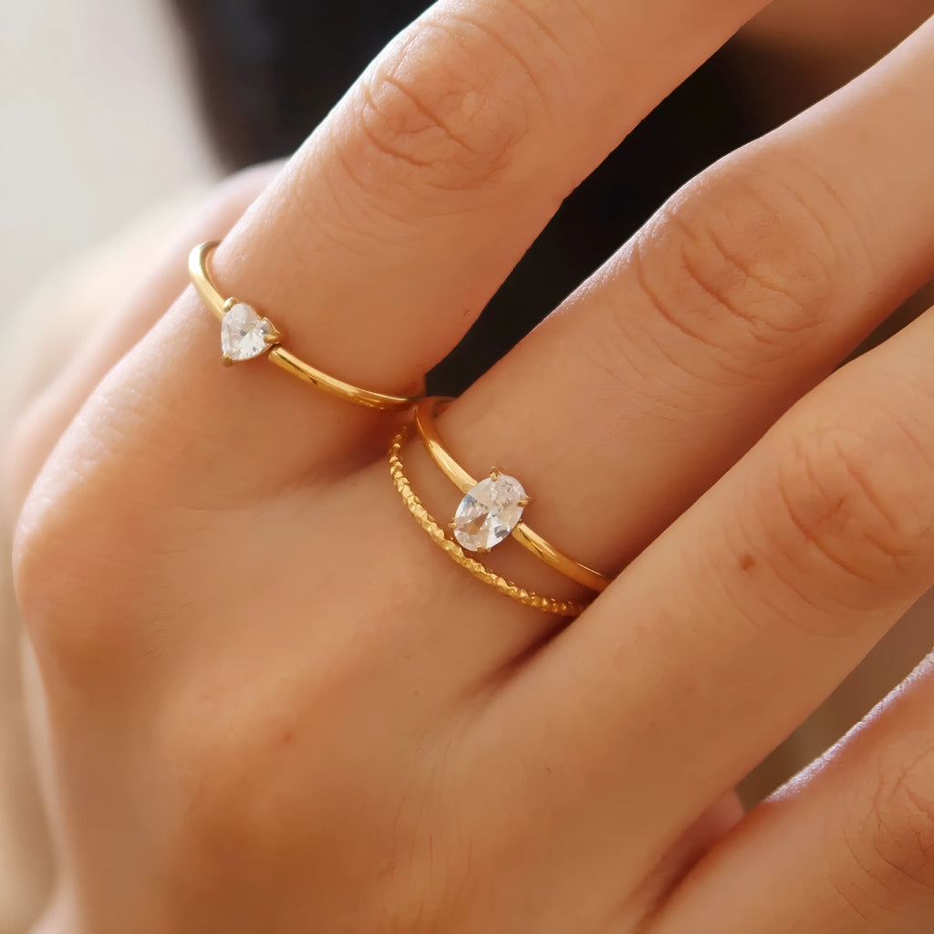Golden electroplated stainless steel love heart ring showing heart shape design elements
