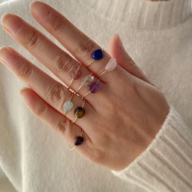 Geometric shaped agate ring for women on a hand, showing original design and coloured stone.