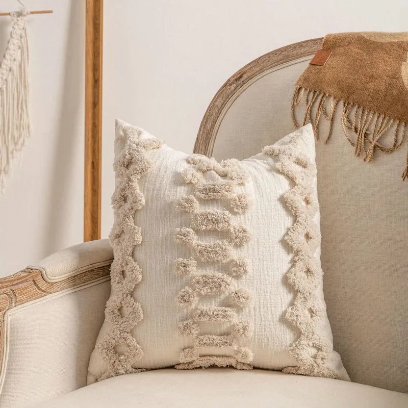 Knitted cushion cover with tassel trim in a striped pattern, shown in a choice of colours including spiral dots and woven rabbit fur.