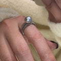 Copper geometric adjustable ring with black pearl finish on feminine hand
