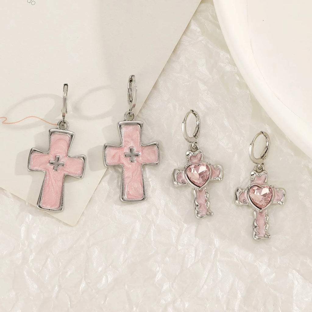 Women's alloy earrings in cross, heart and animal designs with multiple colour options