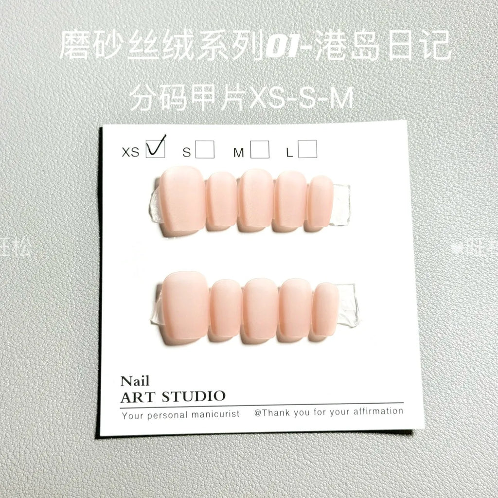 Frosted velvet cat's eye false nails with aurora electroplated finish showing short ladder sizing