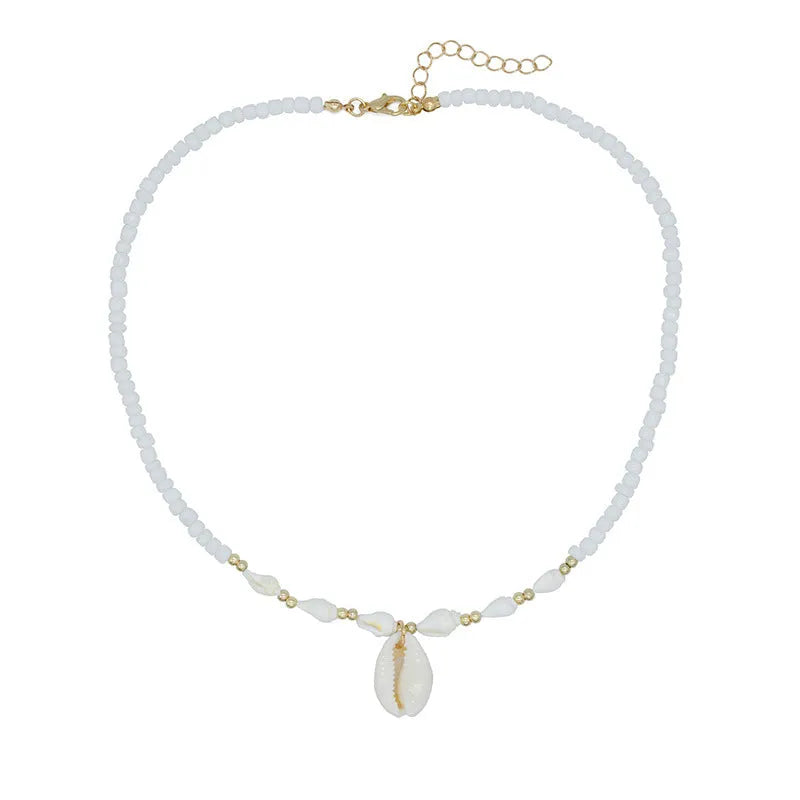 White shell bead necklace with a mother pearl pendant on a silver-toned chain.