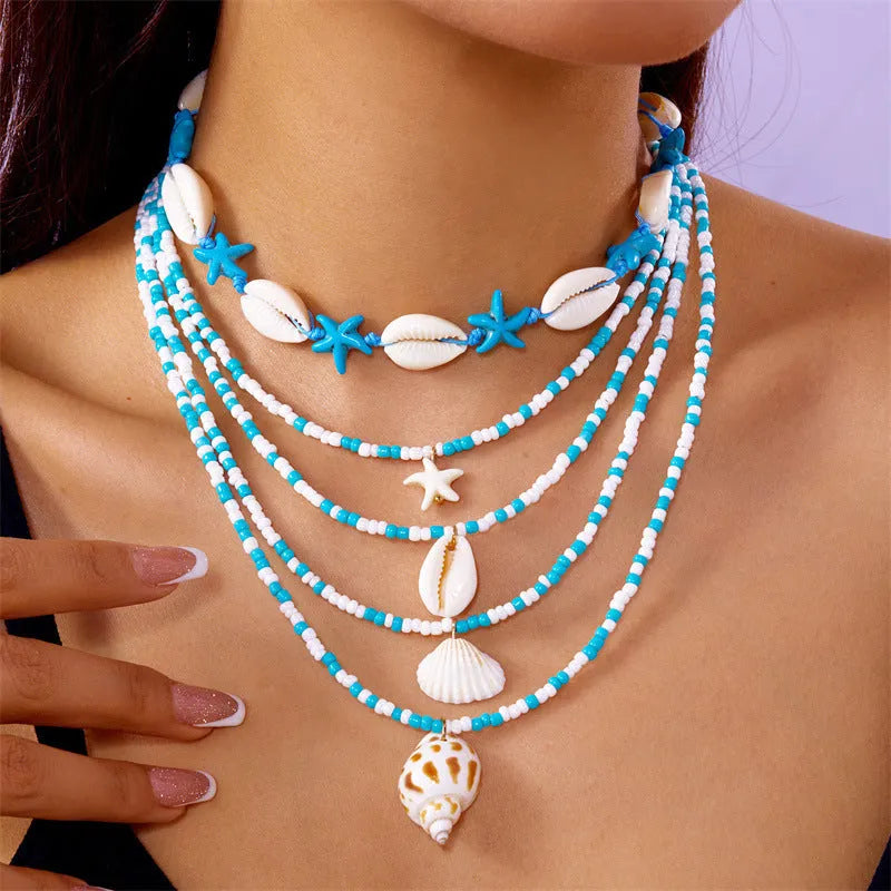 Multi-layer women's necklace with starfish shell pendants on adjustable bead chain