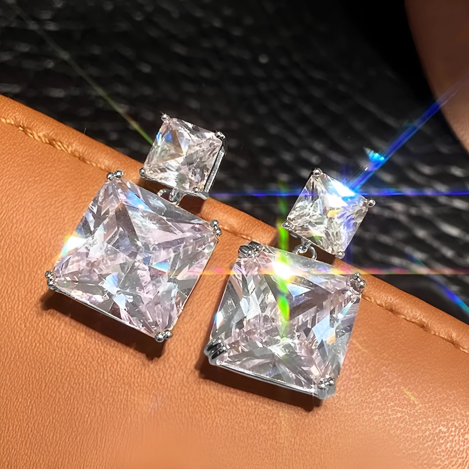 A pair of copper geometric square earrings with a quadrilateral design in a gold colour finish.