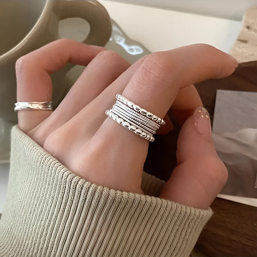 Adjustable opening copper ring with geometric woven twisted multilayer design for women