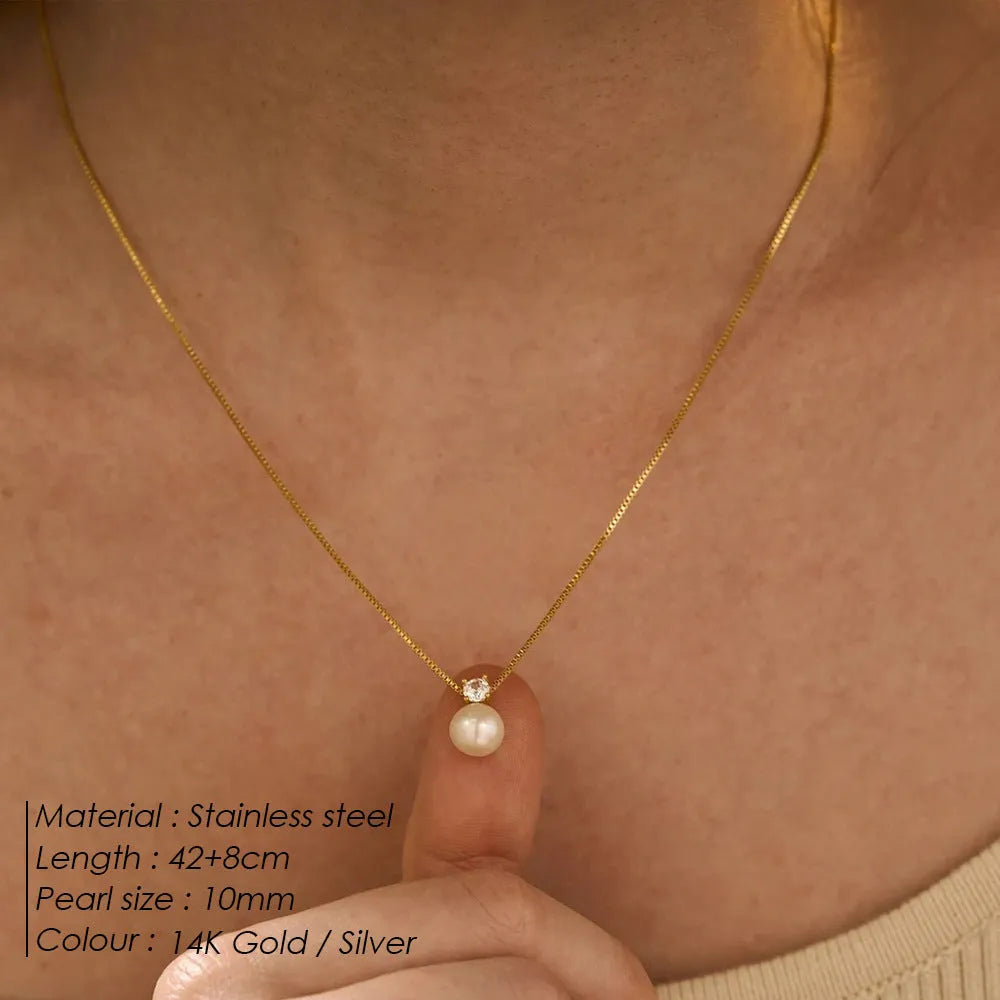 Simple stainless steel necklace for women with imitation pearl and zircon pendant in New Chinese style.