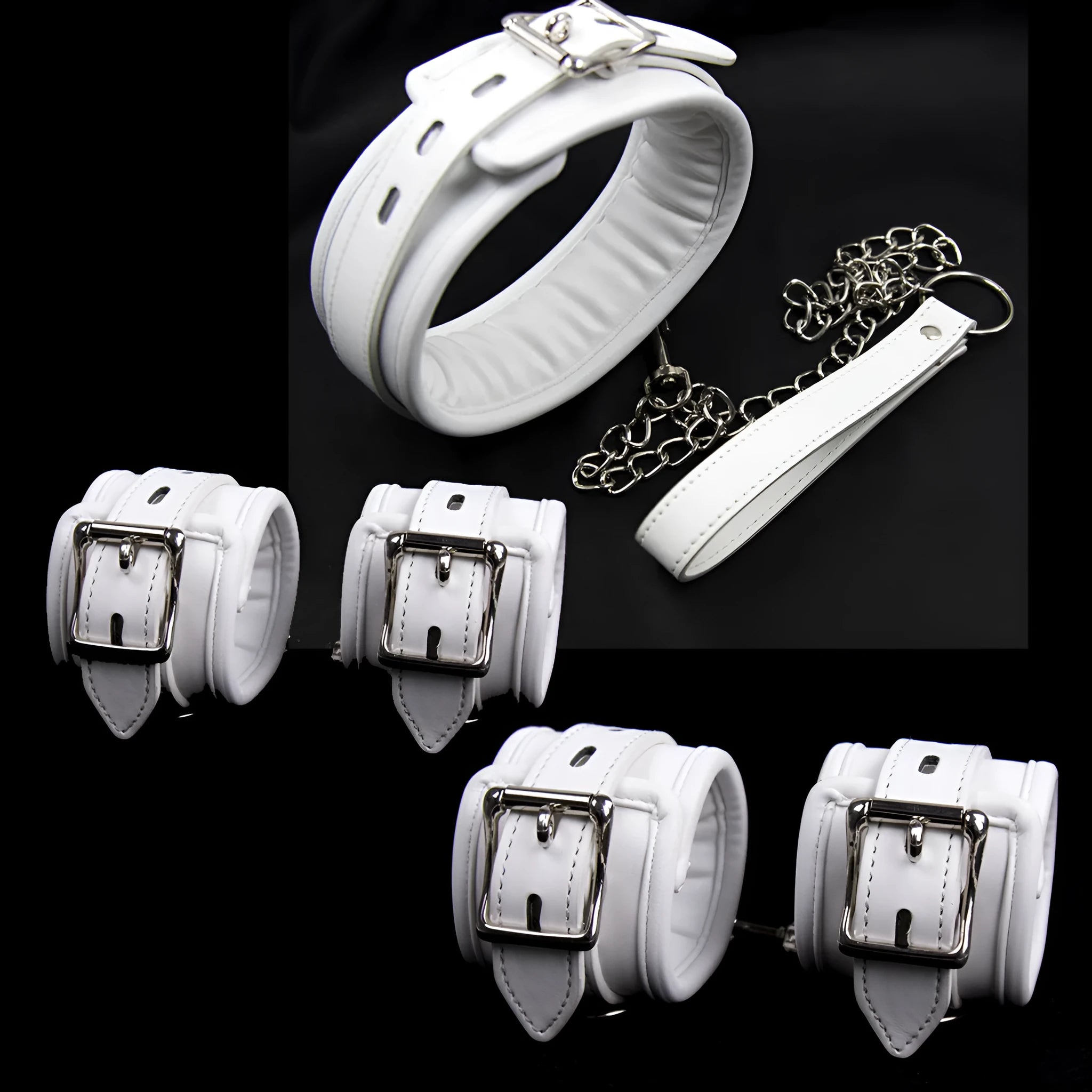White PU sponge bondage set showing handcuffs, footcuffs, and a neck scarf laid out.