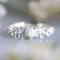 Peach coloured heart-shaped women's ring with floral opal ocean design on electroplated alloy