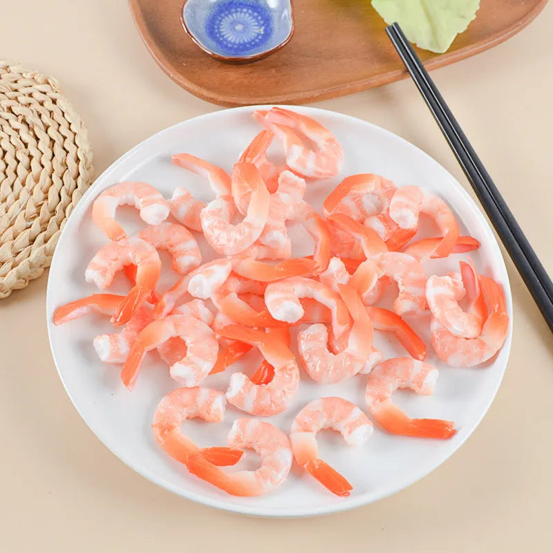 Close-up of a white simulation shrimp PVC keychain pendant showing its 1.5cm thickness.