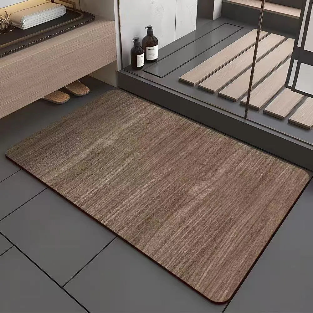 Square diatom mud bathroom floor mat with a brown wood grain geometric pattern on a tiled floor.