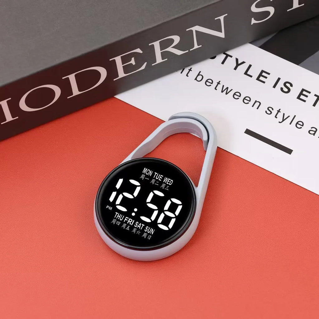 LED digital wristwatch showing time and week day on display, with plastic strap.