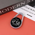 LED digital wristwatch showing time and week day on display, with plastic strap.