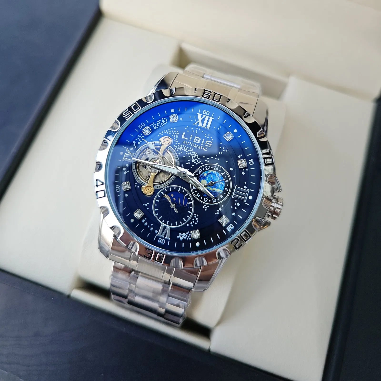 Men's silver automatic watch with black starry luminous dial on a steel bracelet