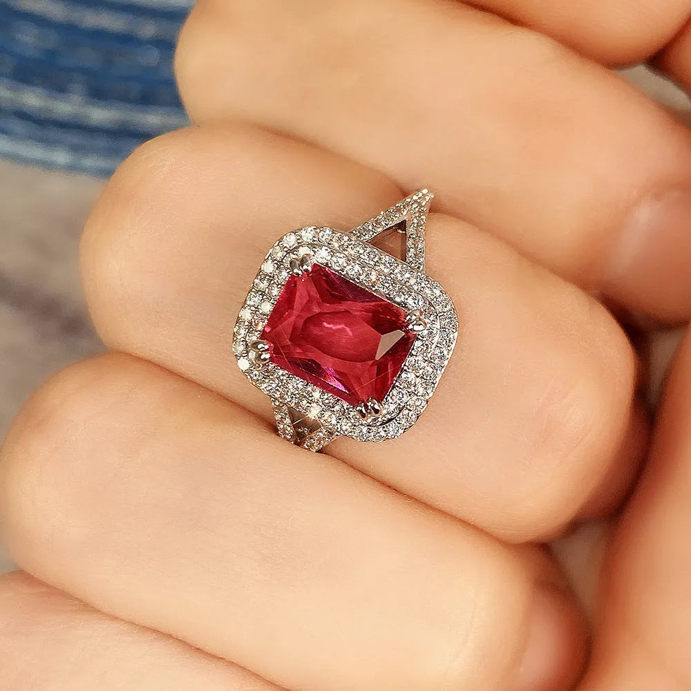 Copper women's ring with a square red rhinestone in a geometric setting.