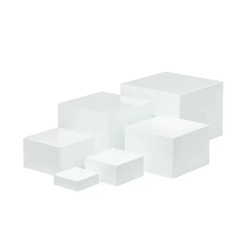 White plastic cube-style dessert display stand with six pieces for cupcakes and cakes.