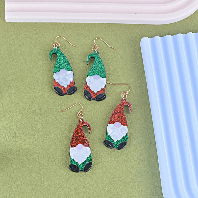 Pair of festive red and green Santa Claus cartoon character acrylic fashion earrings.