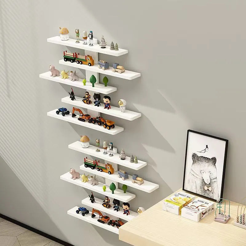 Five-tier white wall-mounted PVC storage rack displaying various dolls and blind box toys.