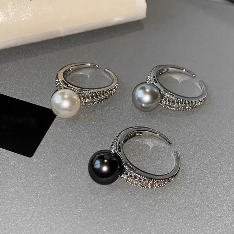Copper geometric adjustable ring with black pearl finish on feminine hand