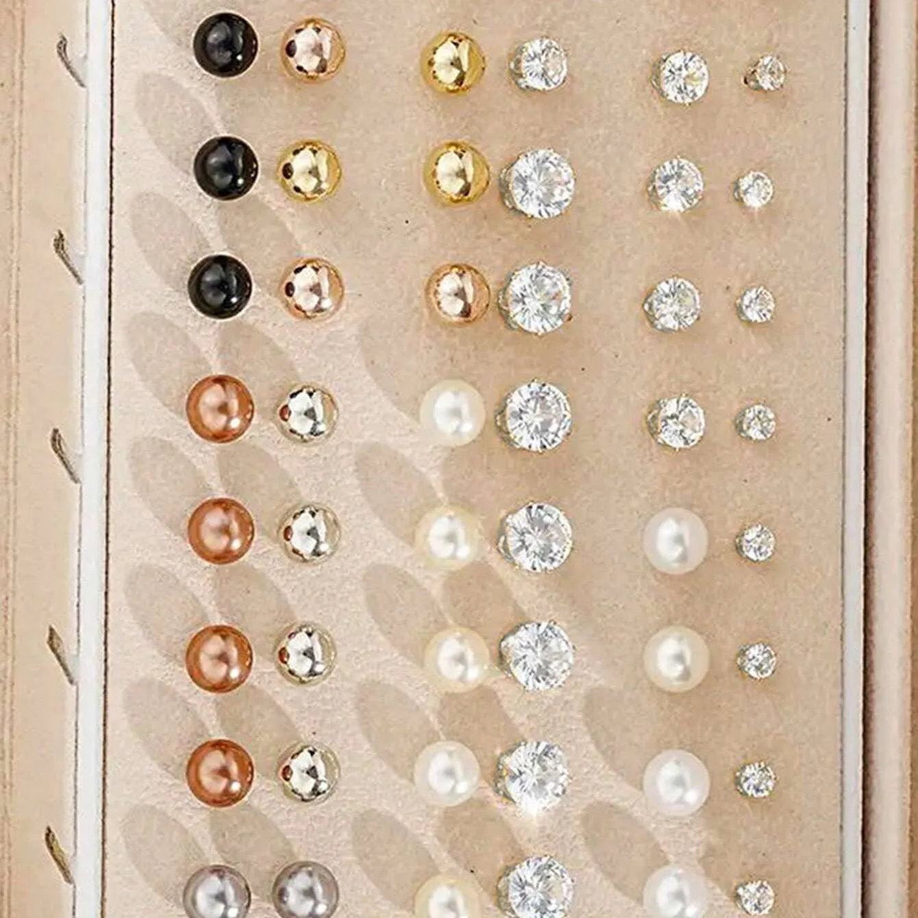 108 gold and yellow geometric alloy pearl earrings arranged in a set.