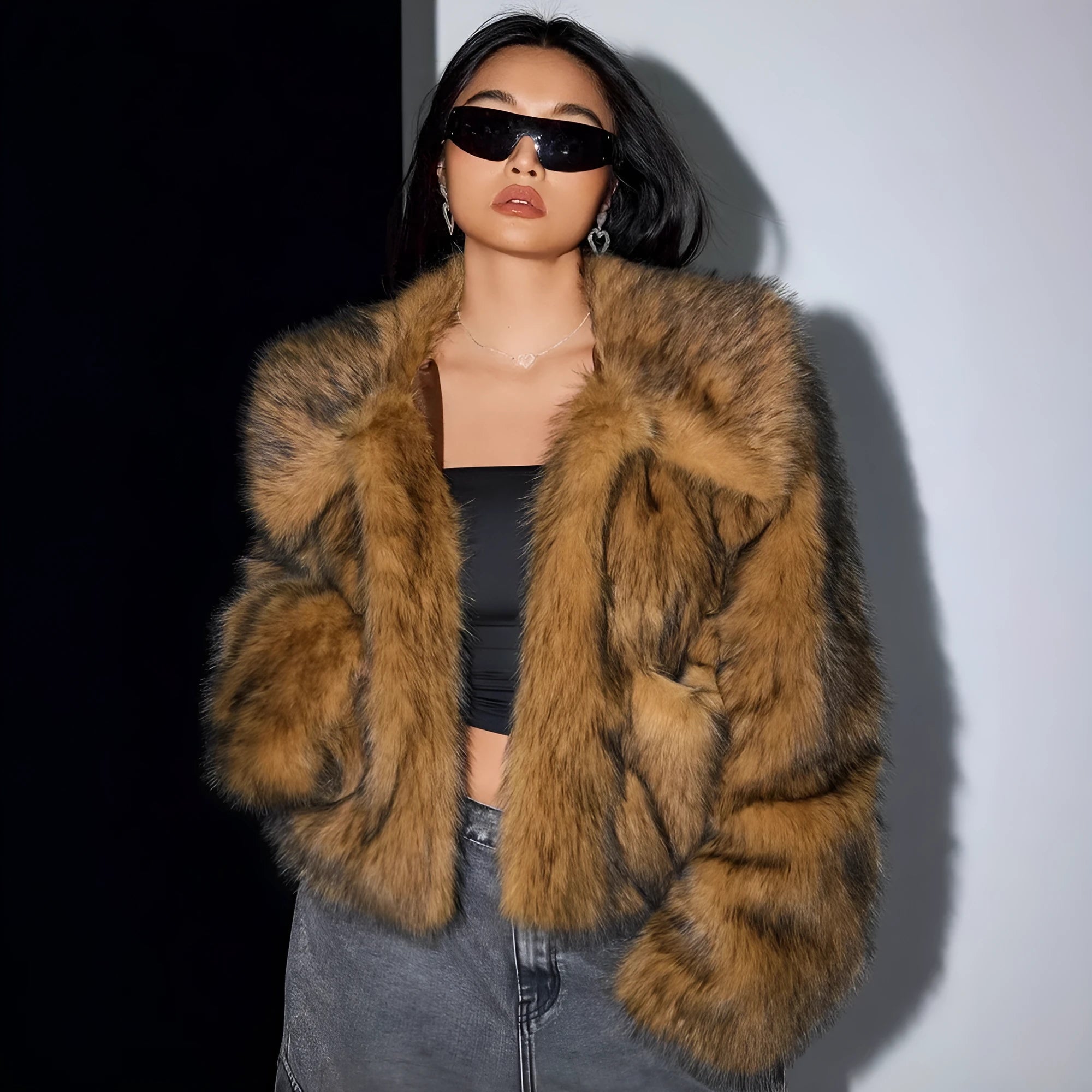Women's short black artificial fur coat with a full fur collar and long sleeves.