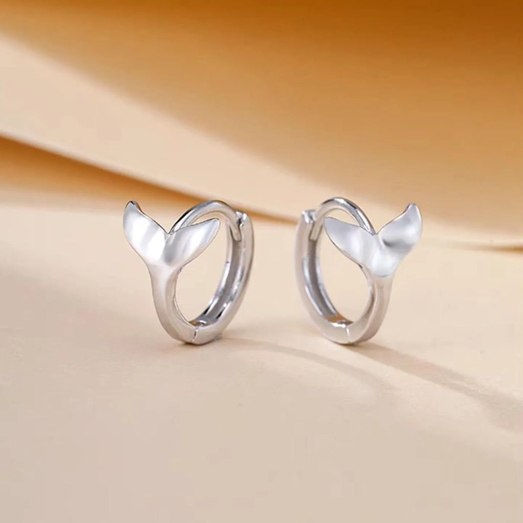 A pair of women's simple fishtail design earrings with an electroplated white gold or yellow gold finish.