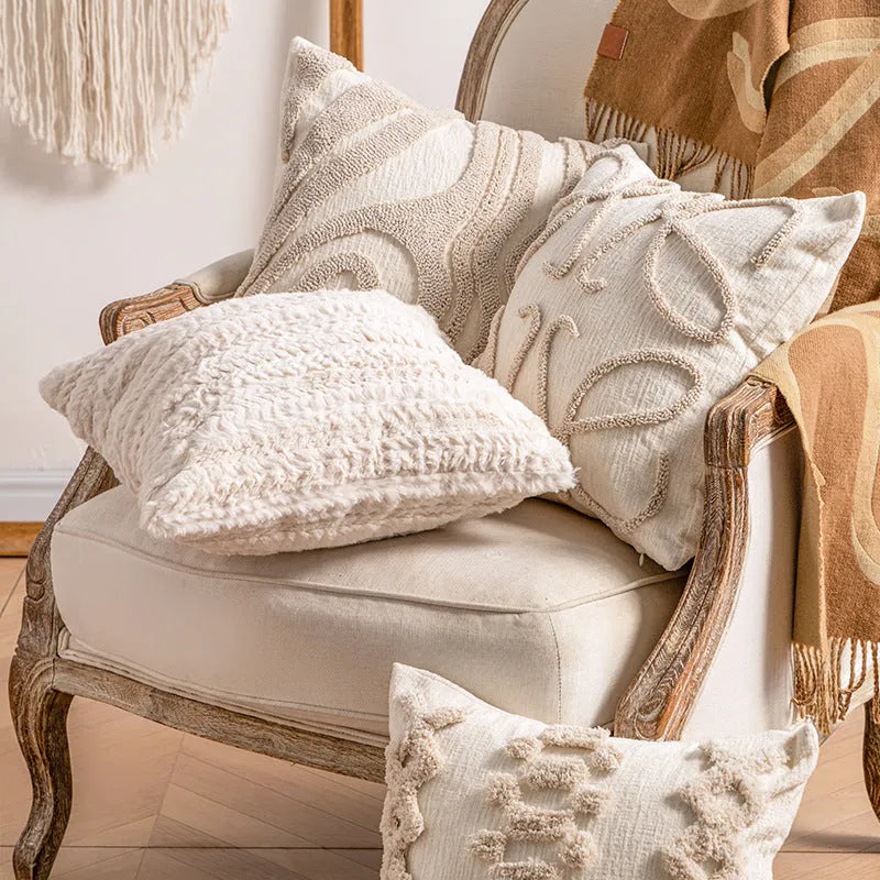Knitted cushion cover with tassel trim in a striped pattern, shown in a choice of colours including spiral dots and woven rabbit fur.
